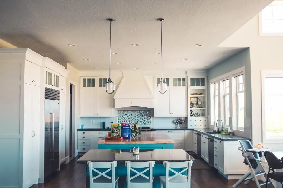 Bright remodeled kitchen with white cabinets