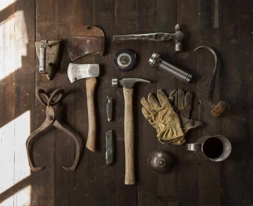 Hand tools laid out on a workbench